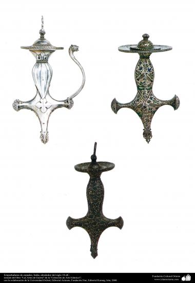 وسایل کهن جنگی و تزئینی - دسته نقش دار شمشیر - قرن هیجدهم میلادی.