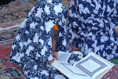 Little Girl learning the Holy Quran (Holy book of Muslims)